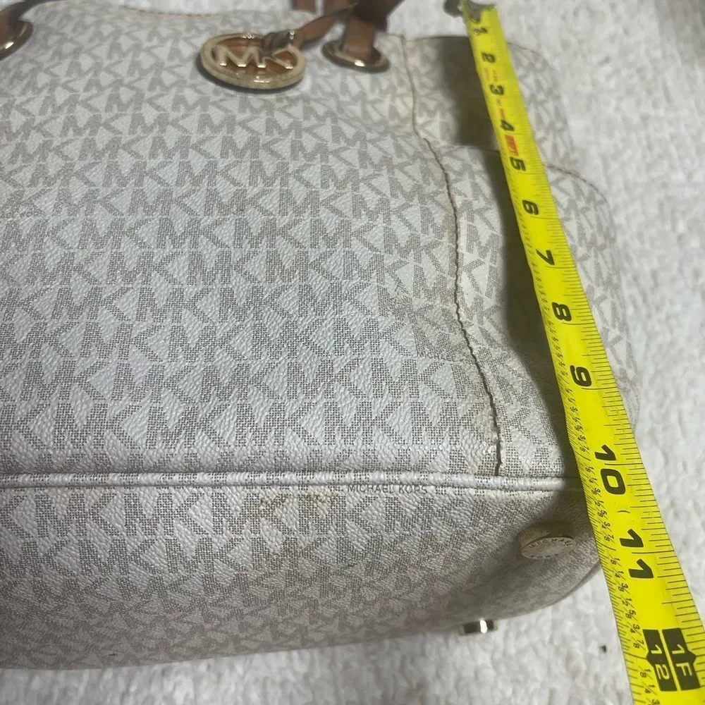 Michael Kors Beige signature Coated Canvas tote , tan leather straps .